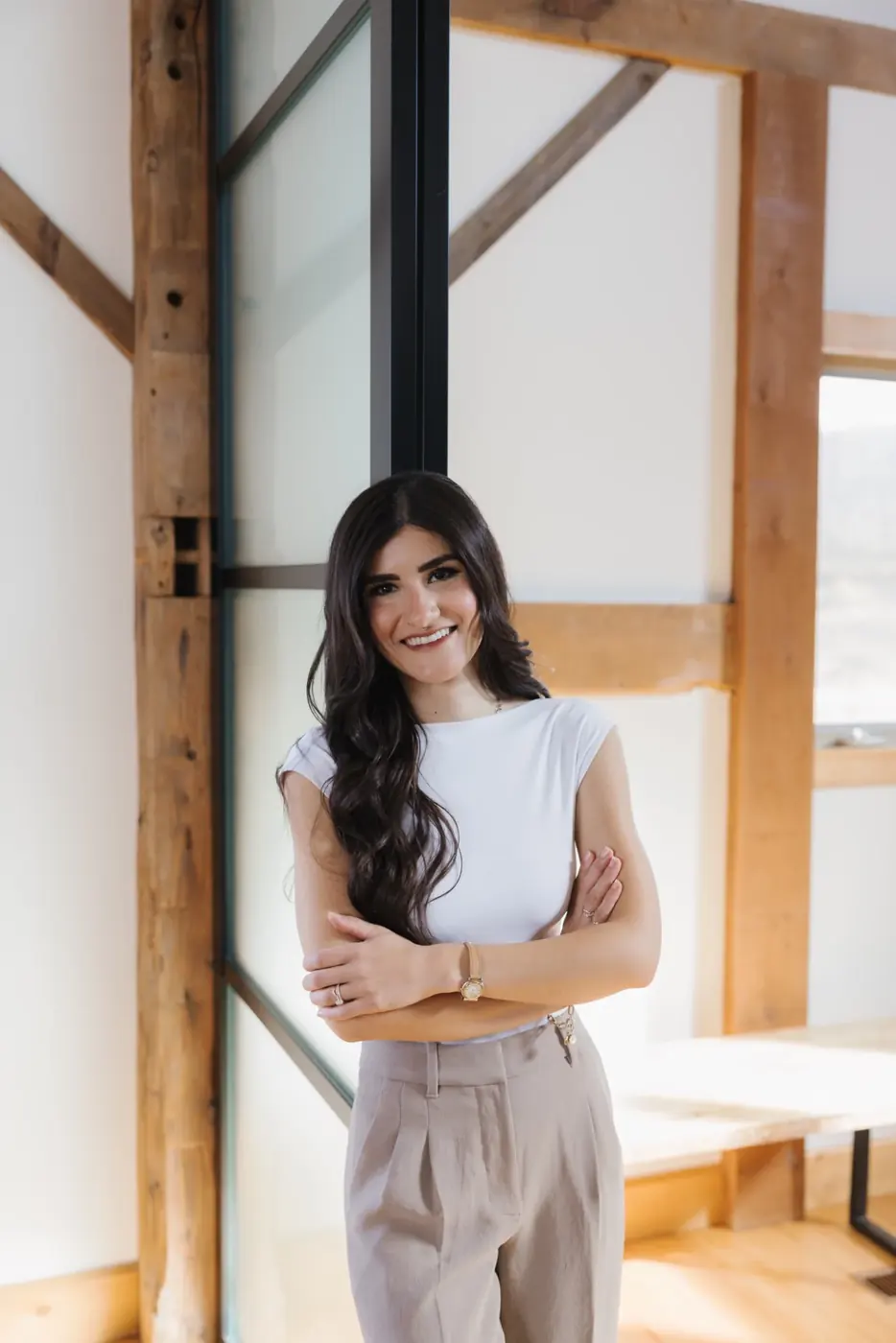 Portrait of Manar Vandervecht in a bright architectural interior