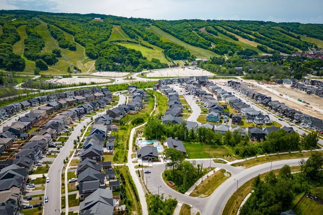 Panoramic view of the Blue Mountains ski hills across forested countryside