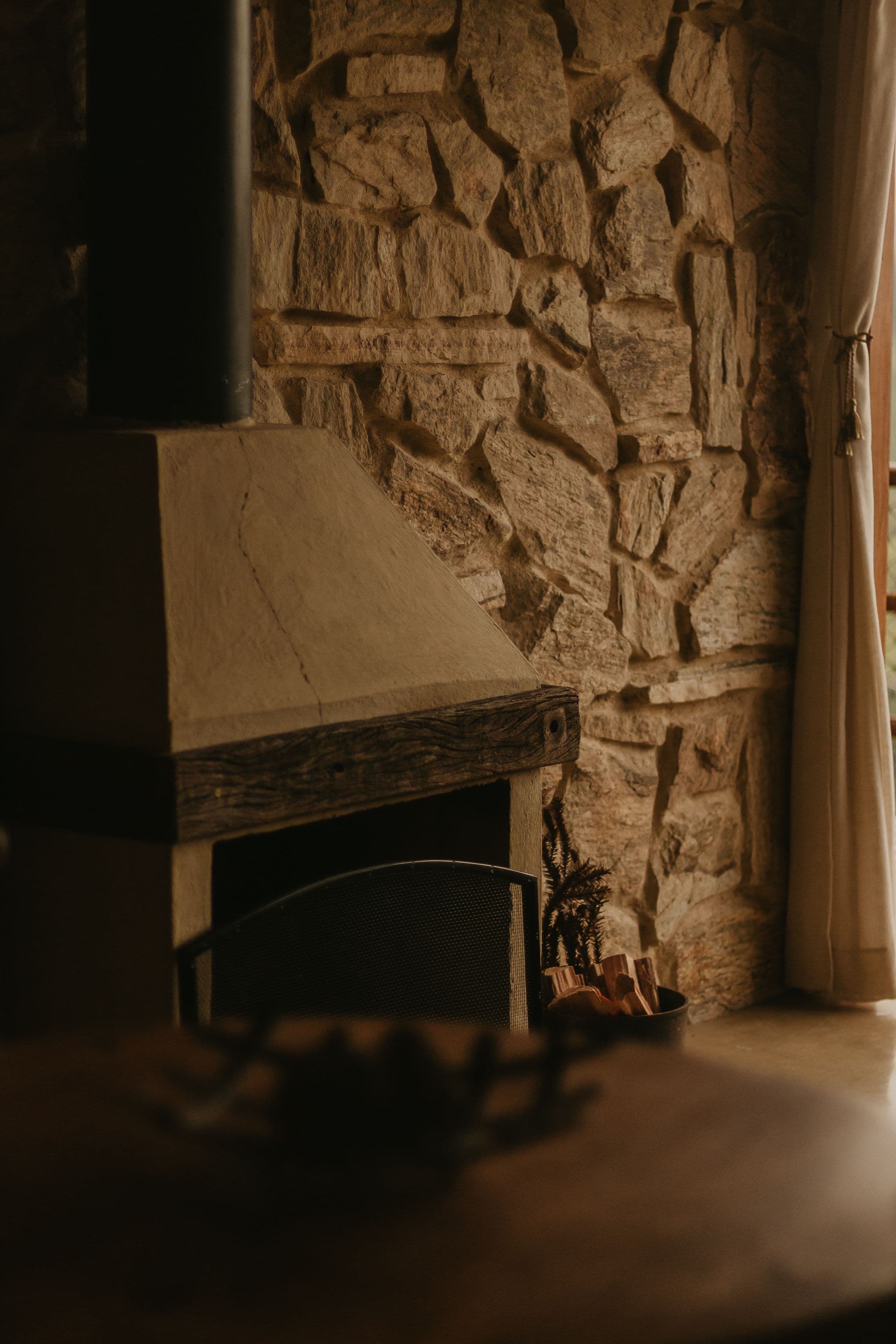 Warm stone interior with a calm, inviting residential feel